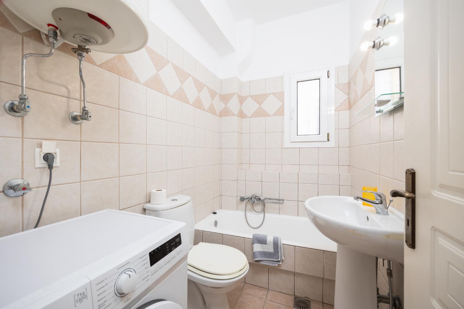En suite bathroom with bath and shower