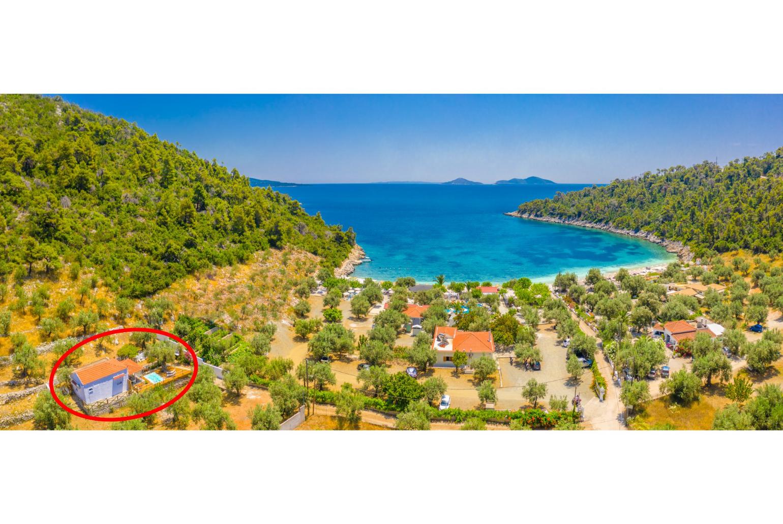 Aerial view of Leftos Gialos Beach showing location of Neptune