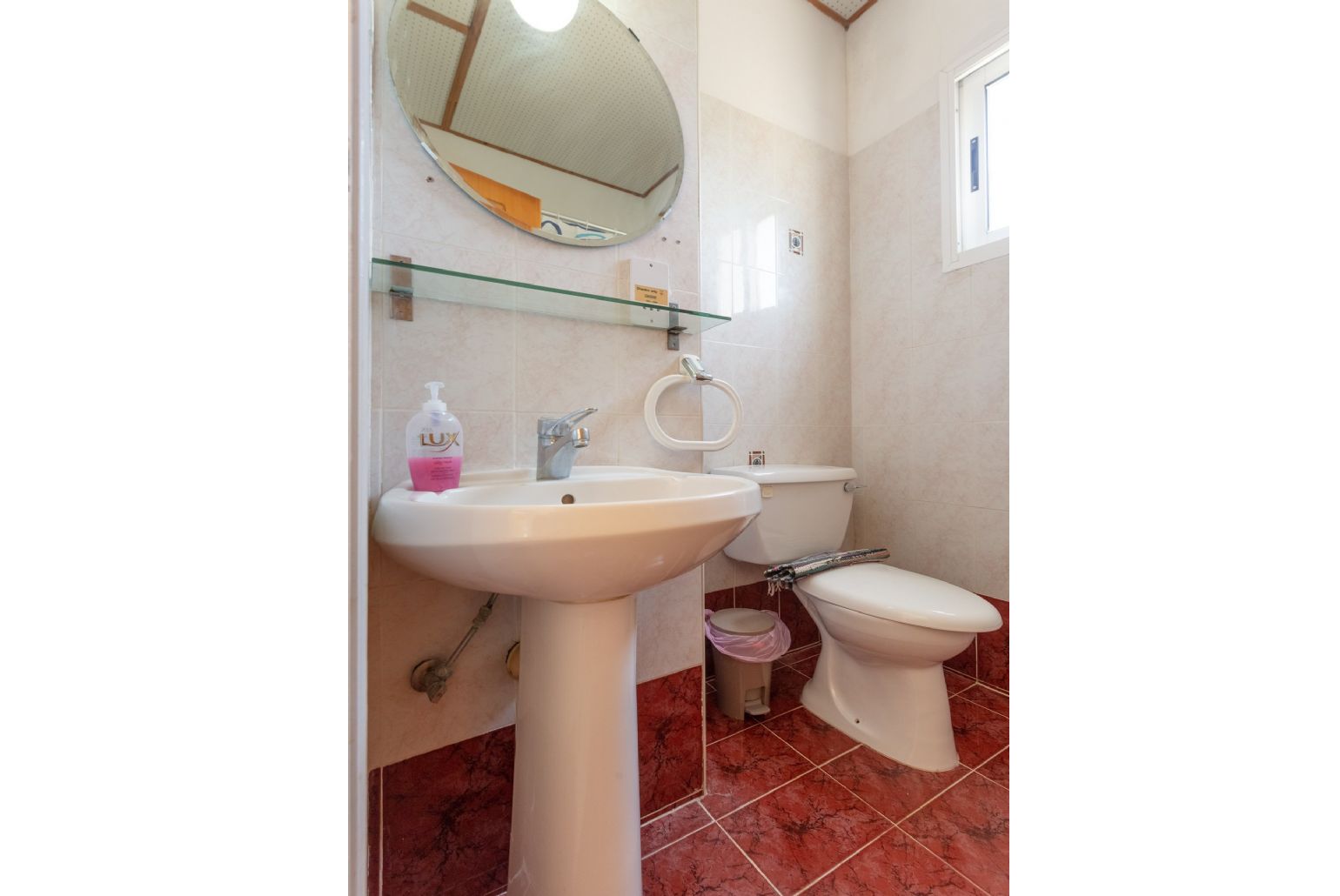 En suite bathroom with bath and overhead shower