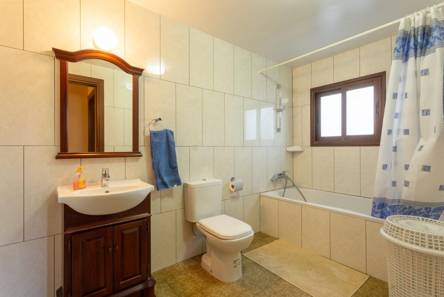 Family bathroom with bath and shower