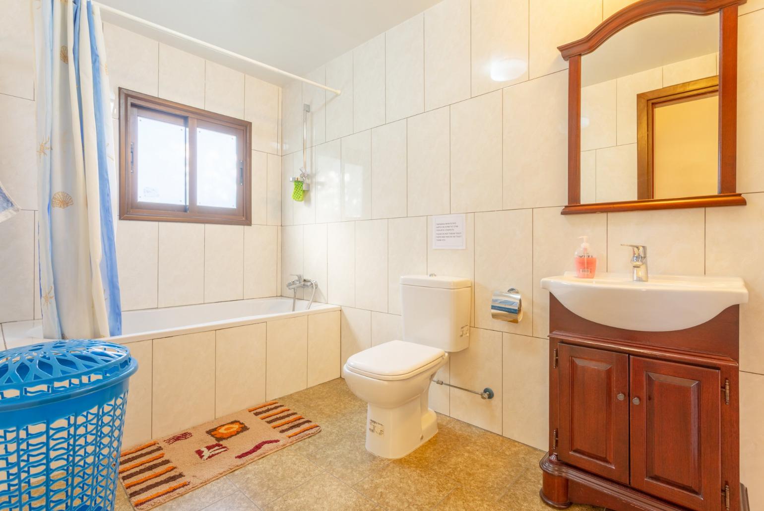 Family bathroom with bath and shower