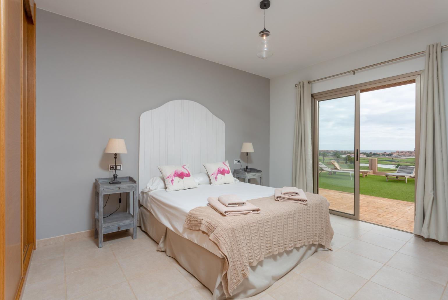 Double bedroom with en suite bathroom and pool terrace access