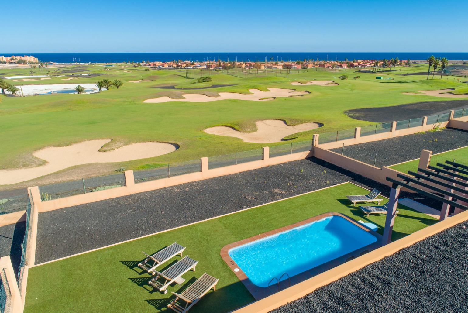 Aerial view of pool terrace with sea views