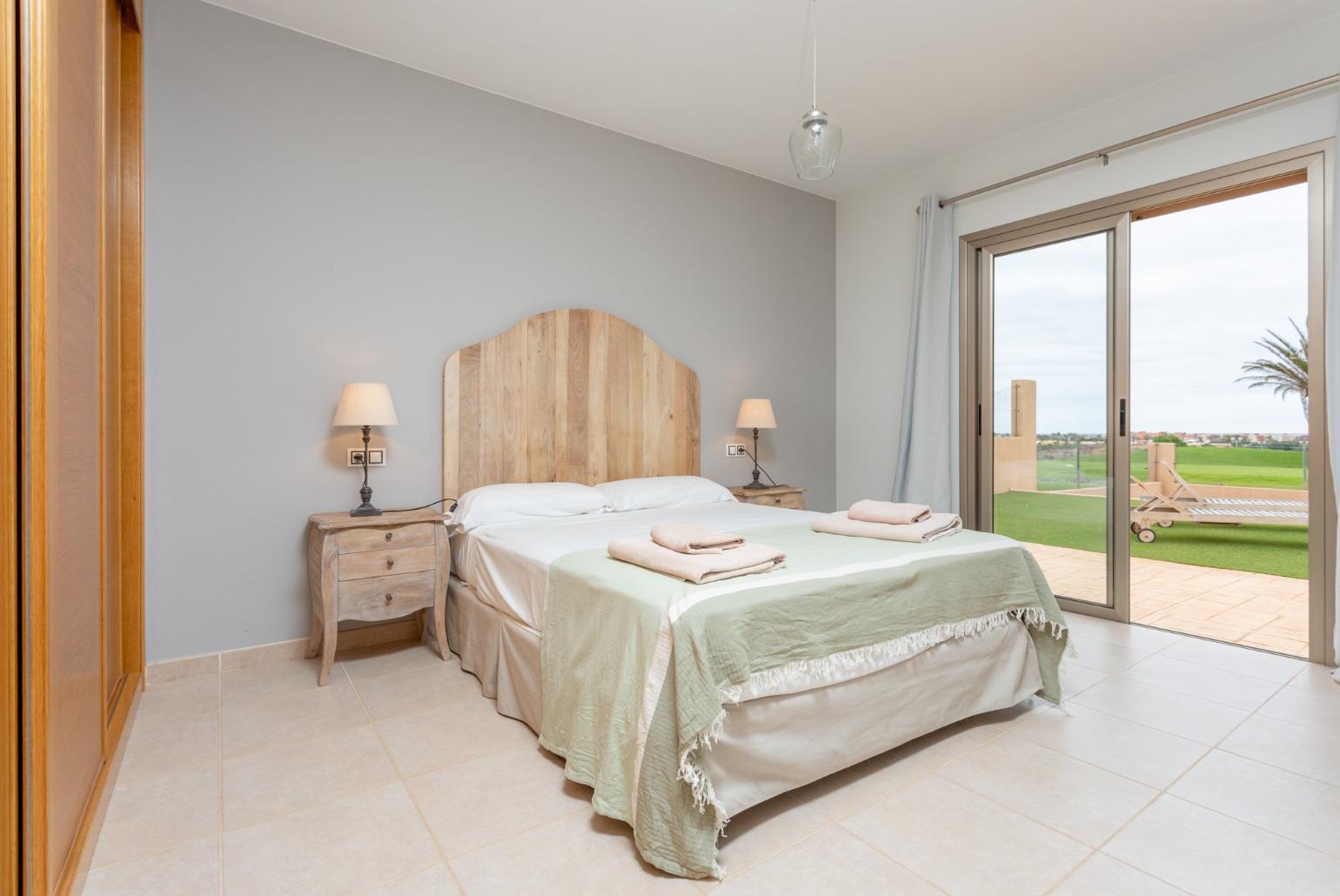 Double bedroom with en suite bathroom and pool terrace access