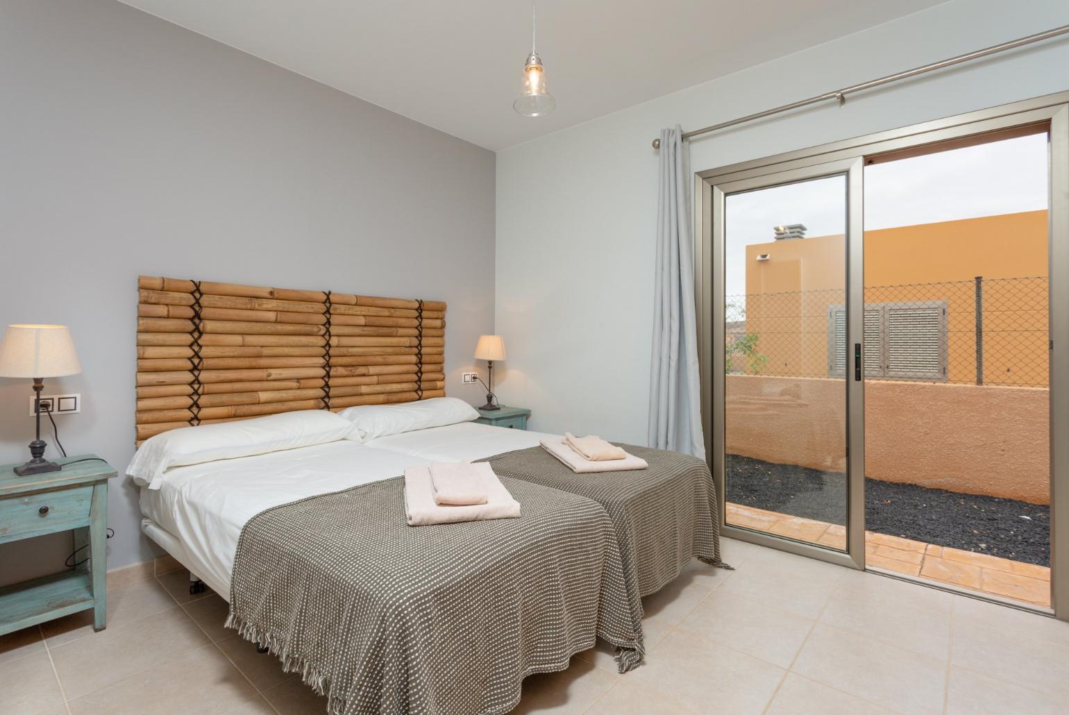 Twin bedroom with pool terrace access