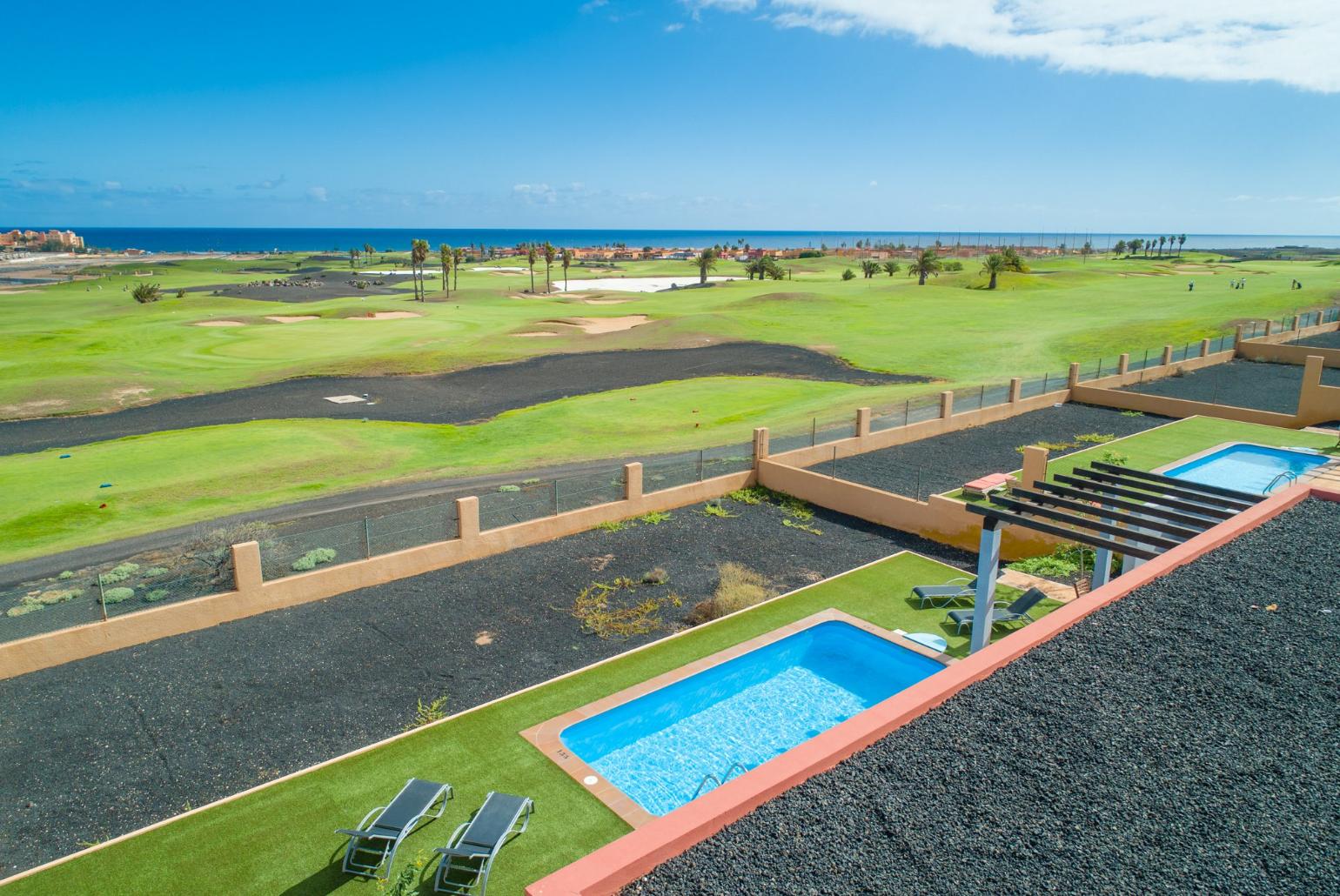 Aerial view of pool terrace with sea views