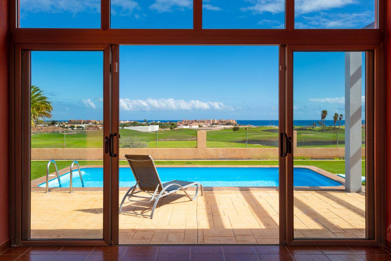 View of pool and terrace from atrium