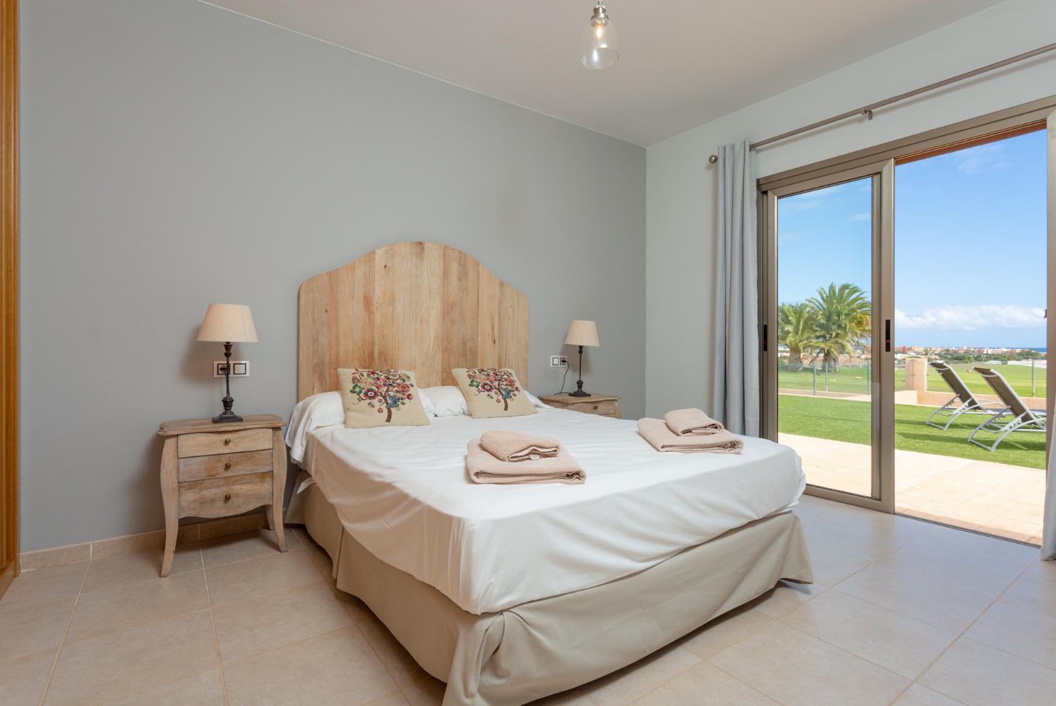 Double bedroom with en suite bathroom and pool terrace access