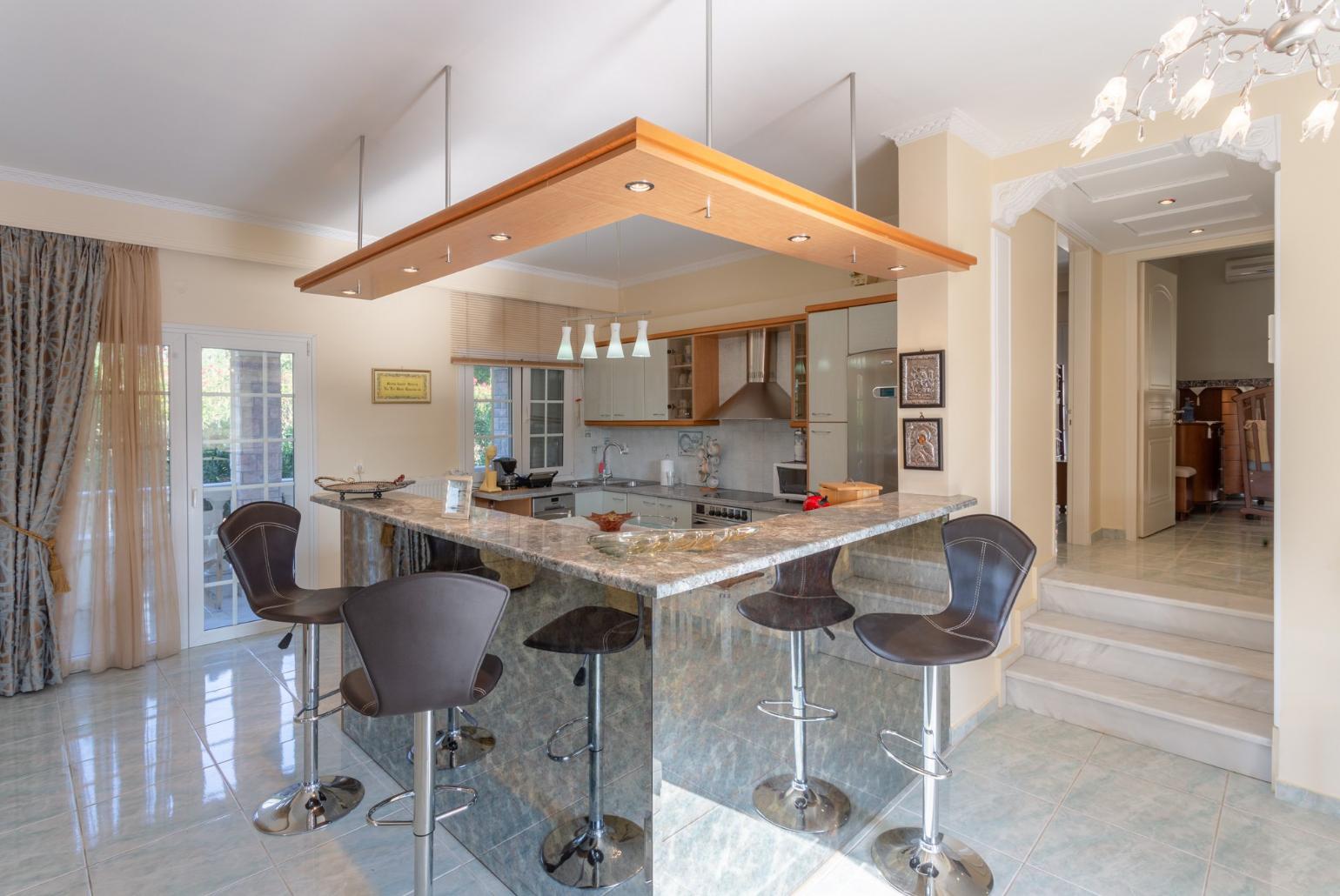  Equipped kitchen and open plan dining area.