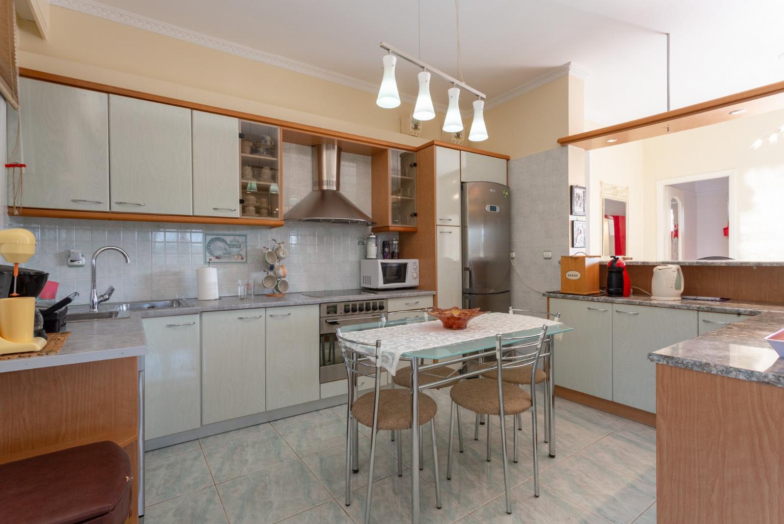  Equipped kitchen and open plan dining area.