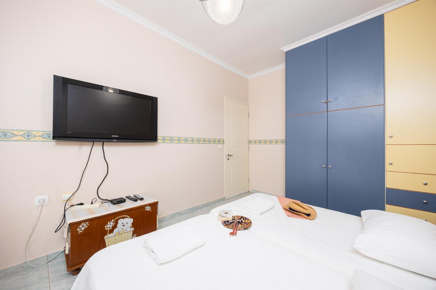 Bedroom with twin beds, bunkbed, and A/C