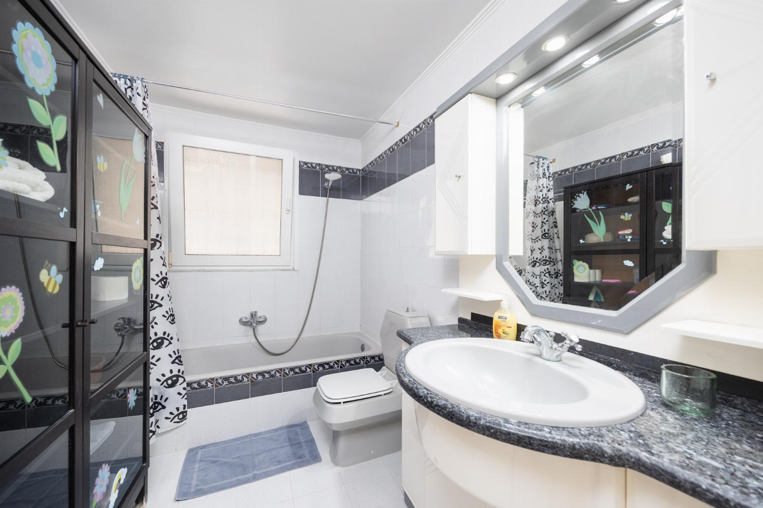 Family bathroom with bath and shower