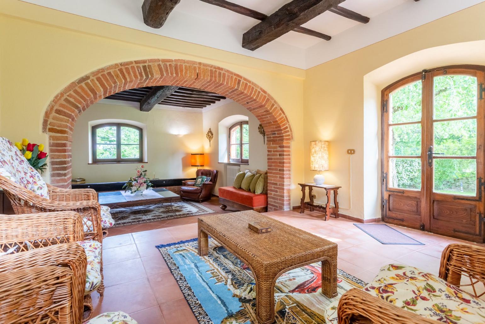 Living room with sofas, dining area, ornamental fireplace, WiFi internet, satellite TV, and garden access