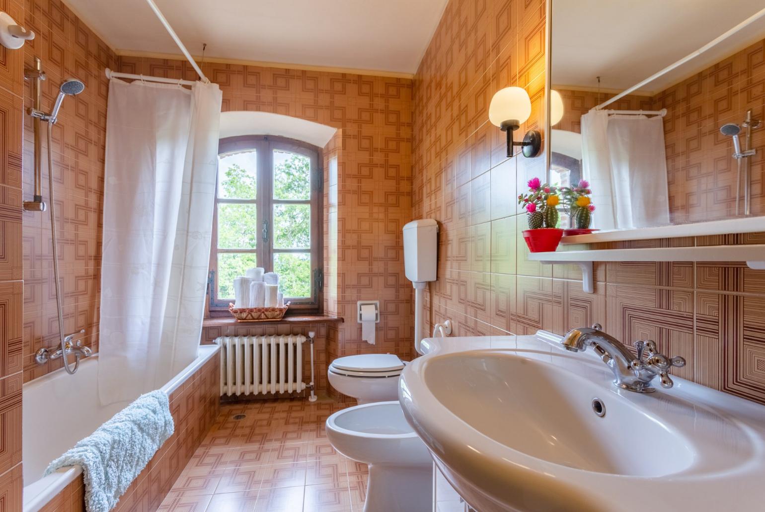 Family bathroom with bath and shower