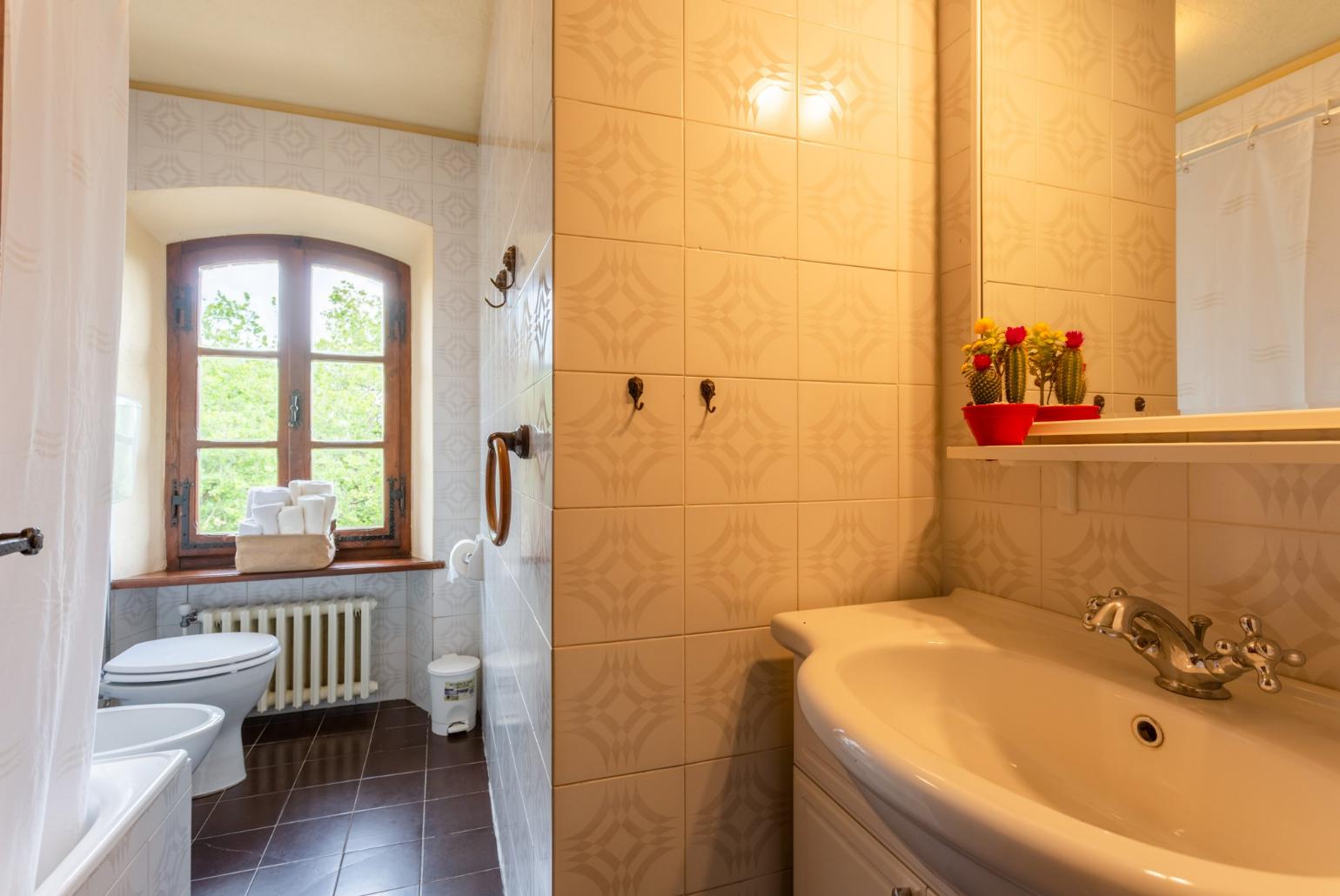 Family bathroom with bath and shower