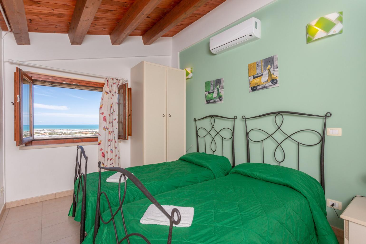 Twin bedroom with A/C and sea views