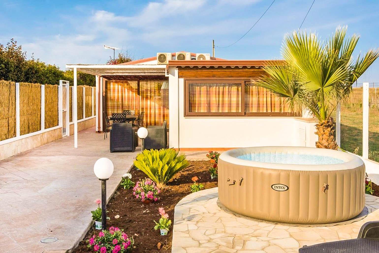 ,Outdoor area with sunbeds and Jacuzzi