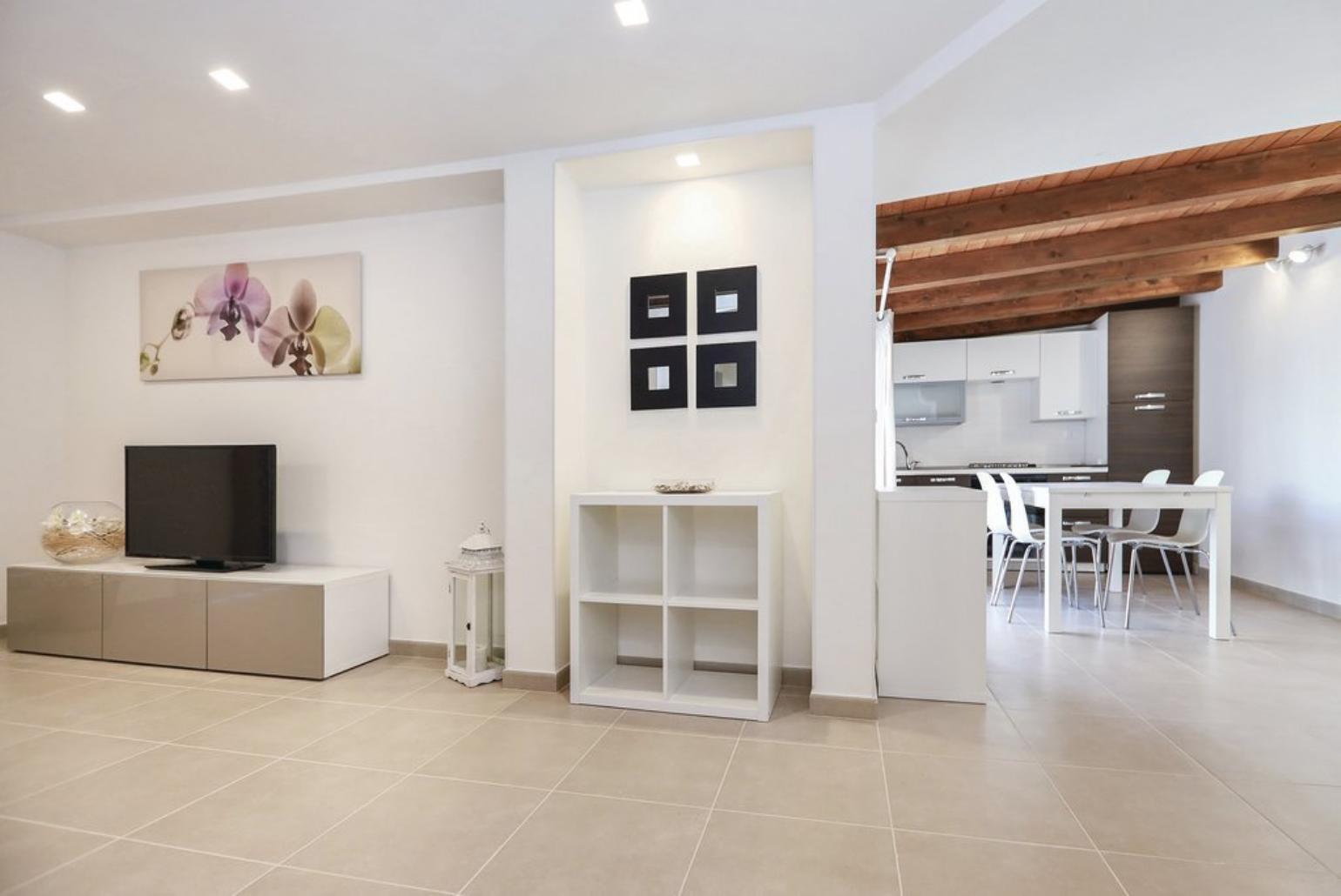 Open-plan living room with WiFi Internet, Satellite TV and dining area.