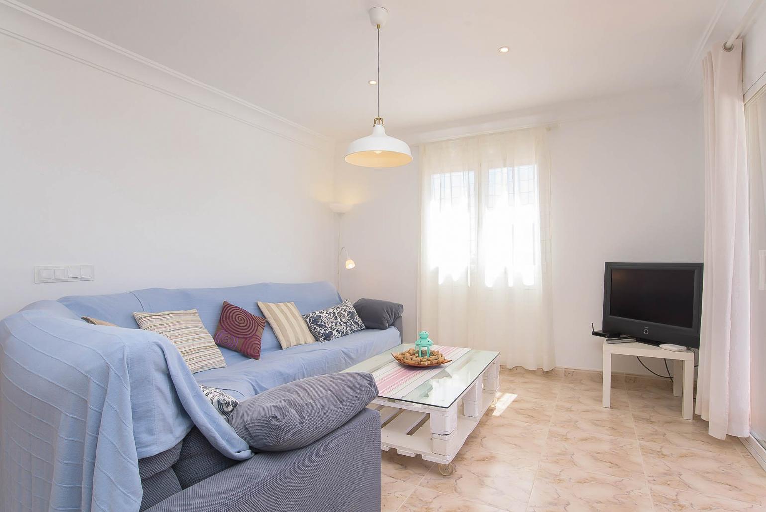 Living room with sofas, and TV