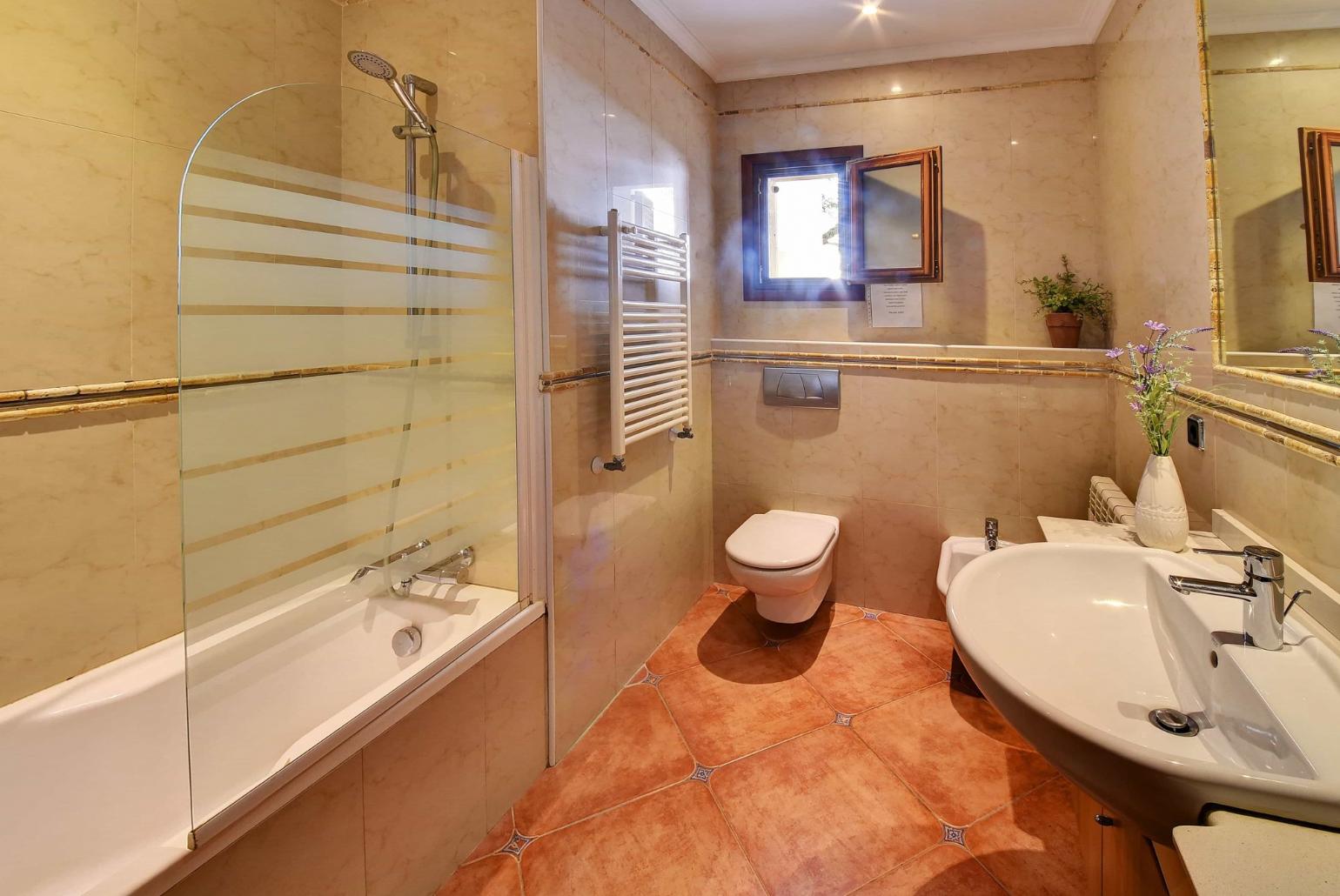 Bathroom with bath and shower