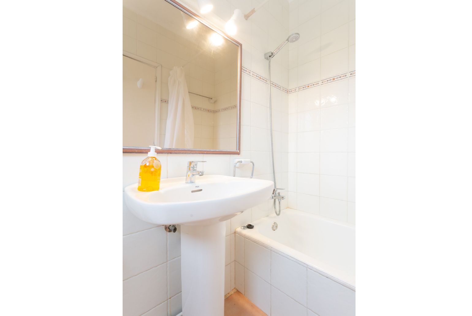 En suite bathroom with bath and shower
