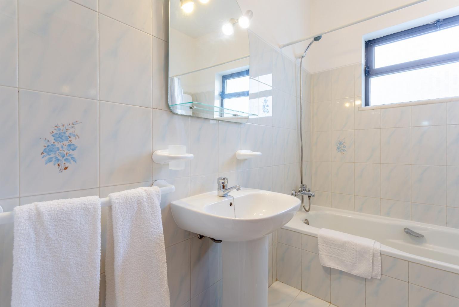 Family bathroom with bath and shower