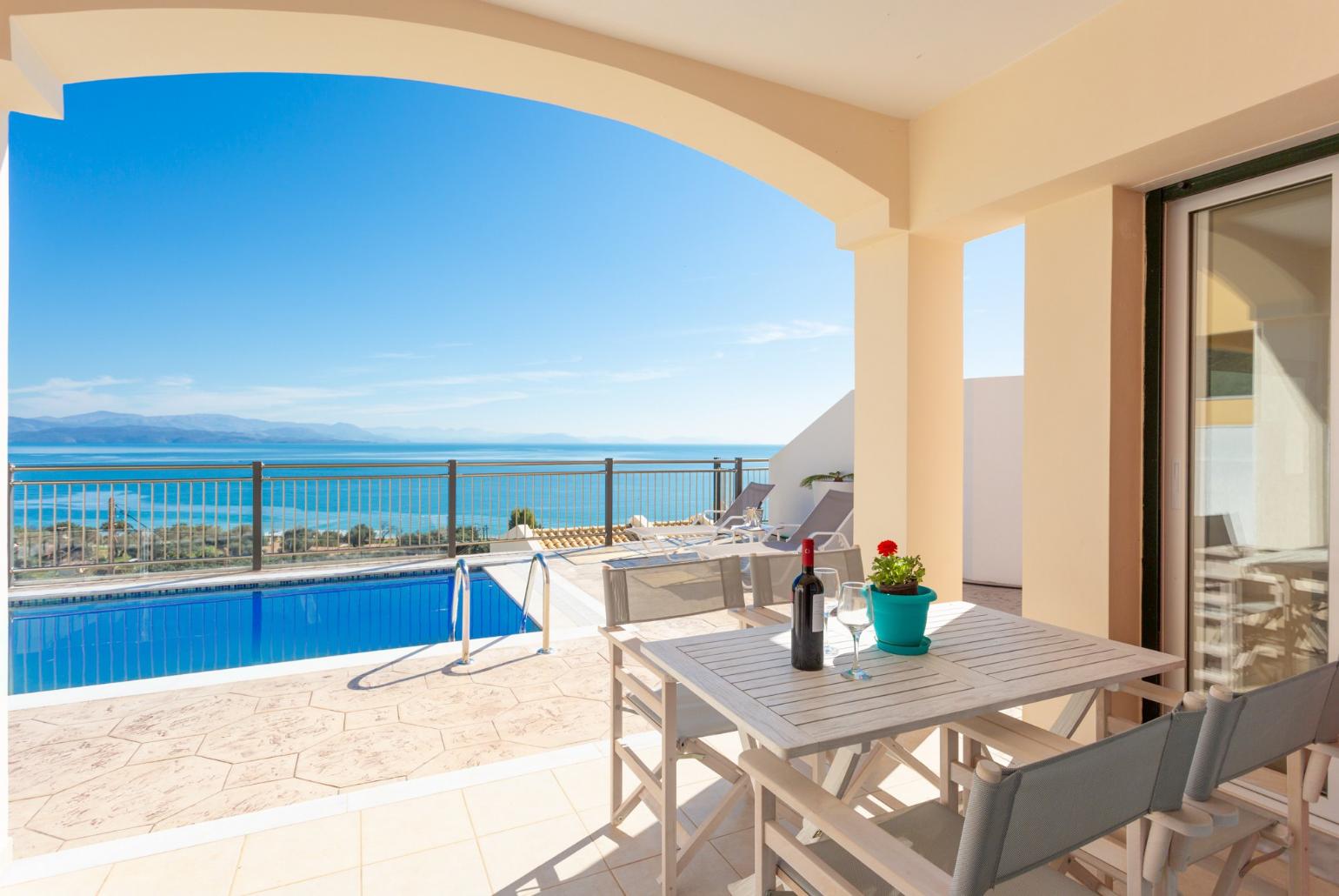 Private pool and terrace area with panoramic sea views