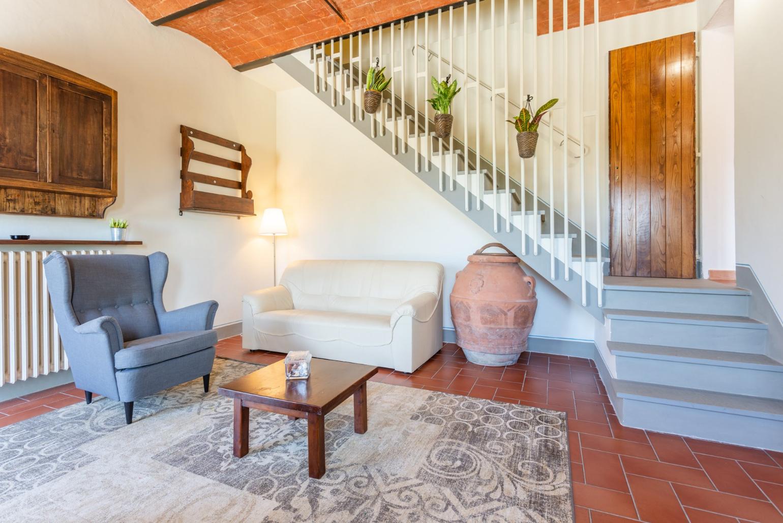 Living room with sofas, WiFi internet, satellite TV, and terrace access