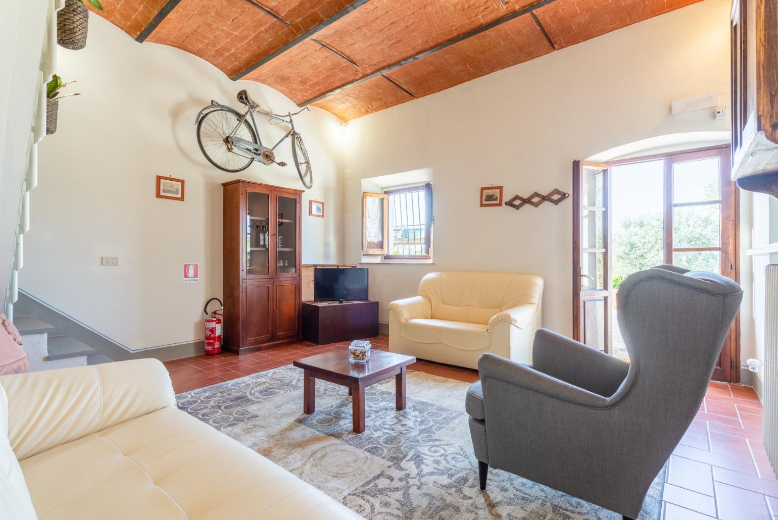 Living room with sofas, WiFi internet, satellite TV, and terrace access