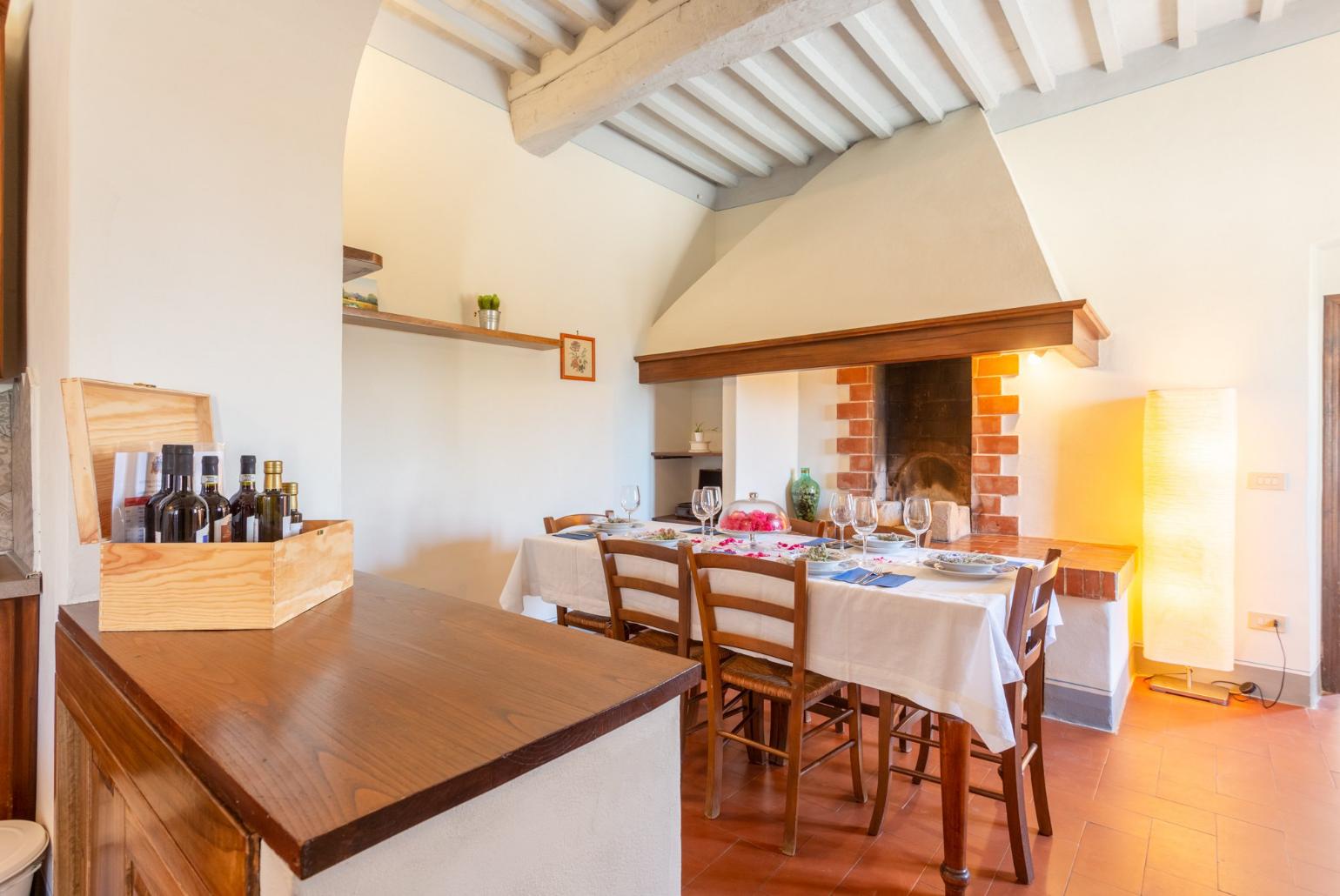 Dining room with kitchen, ornamental fireplace, WiFi internet, satellite TV, and terrace access