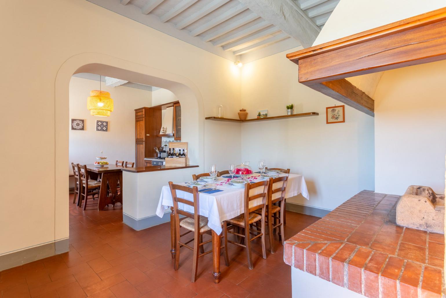 Dining room with kitchen, ornamental fireplace, WiFi internet, satellite TV, and terrace access