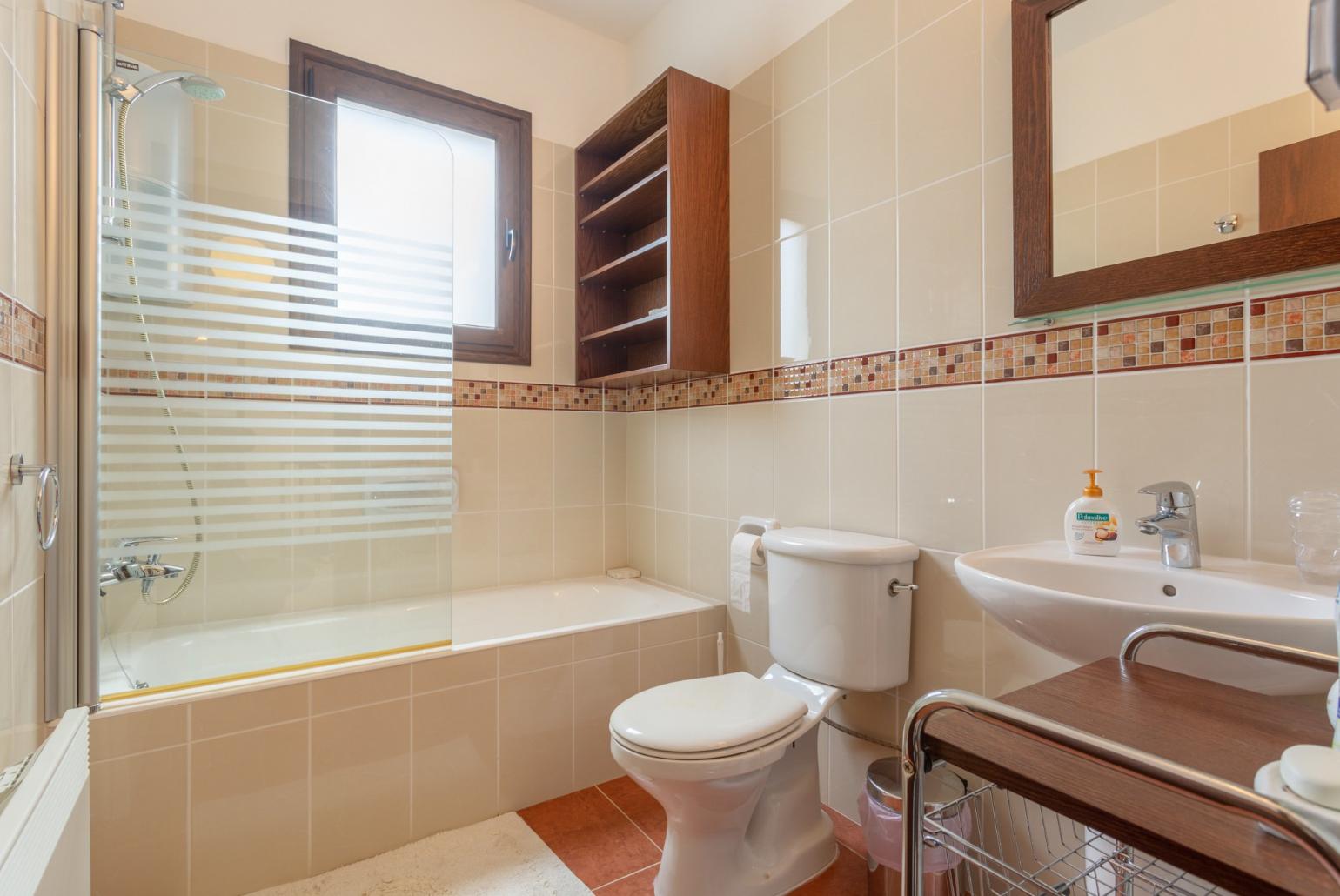 Family bathroom with bath and shower