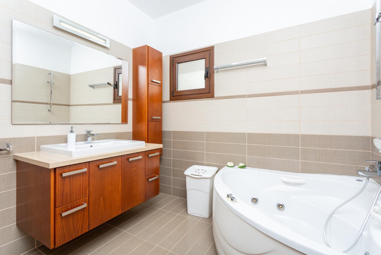 Family bathroom with spa bath and shower