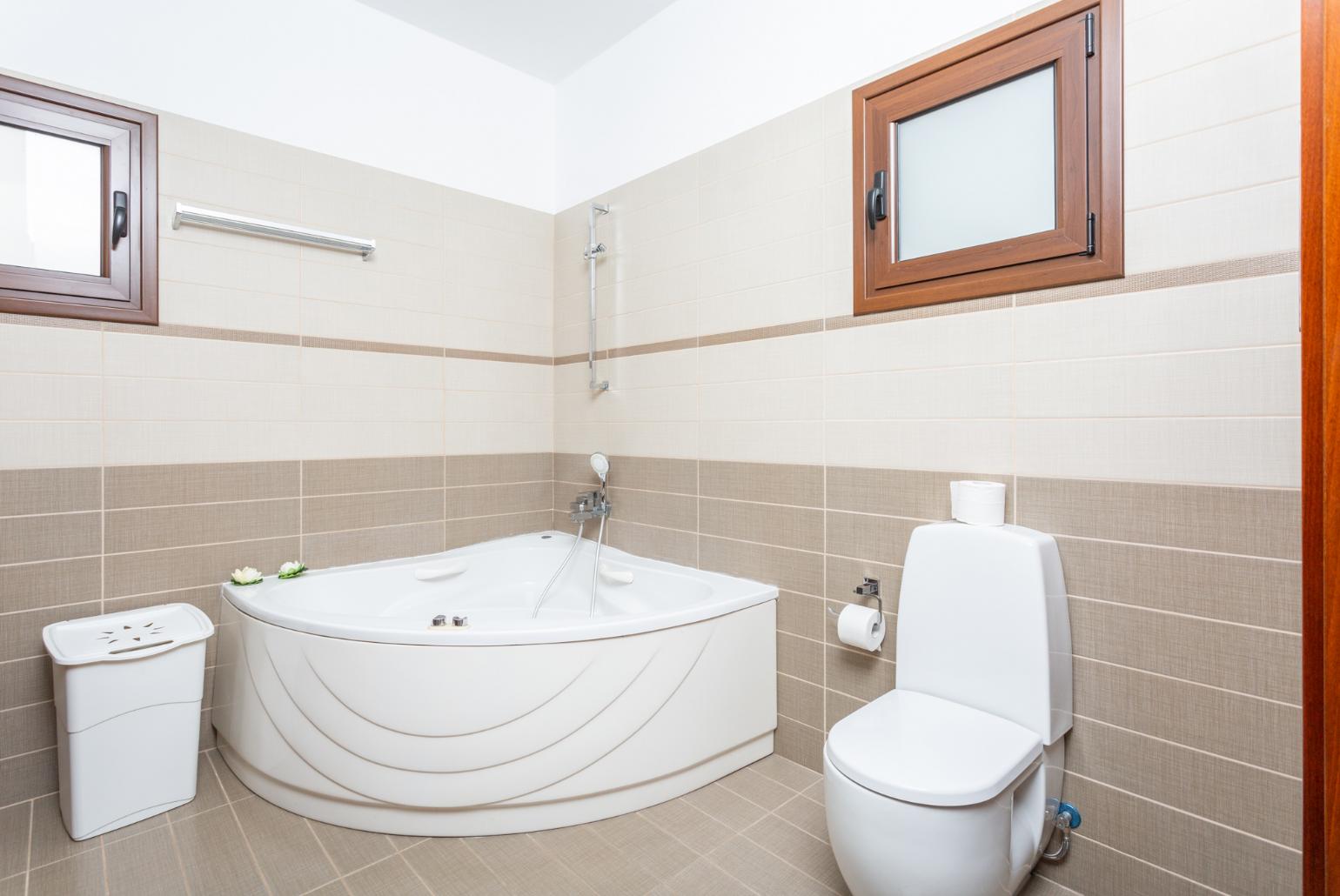 Family bathroom with spa bath and shower