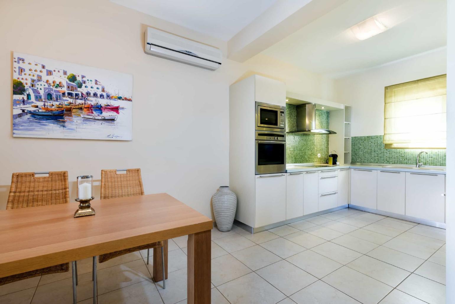 Equipped kitchen with dinning table and A/C