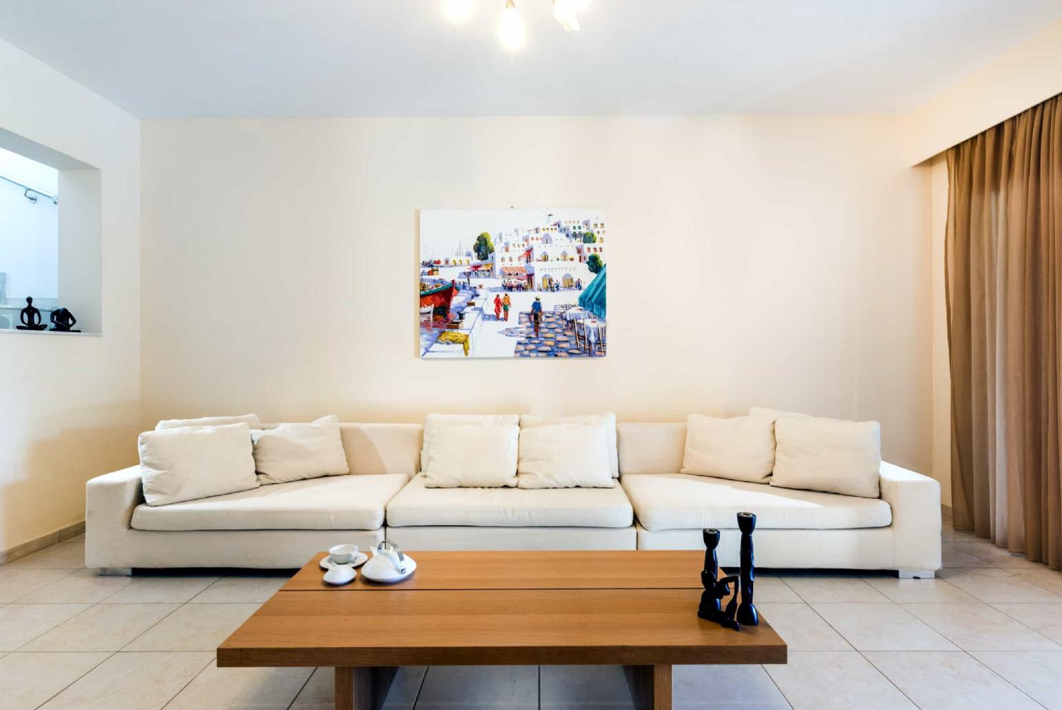 Open plan living room with TV and indoor dining 