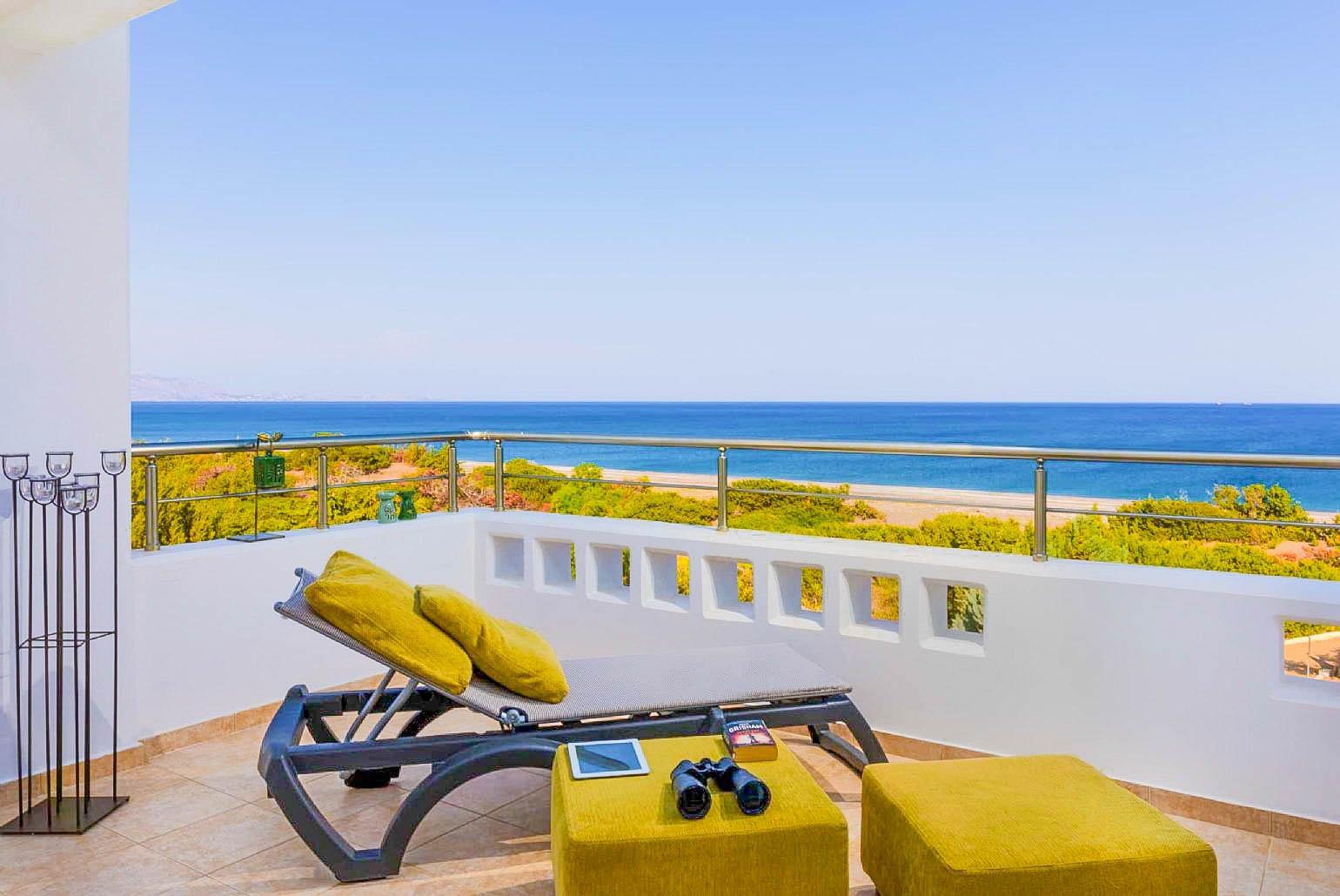 Balcony with sunbed and panoramic sea views