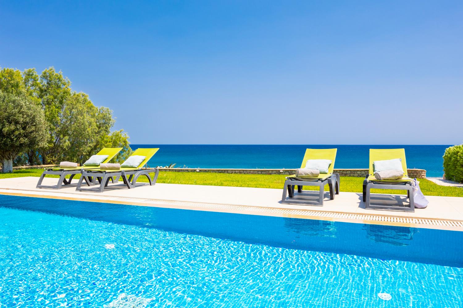 Private pool, terrace, and garden with sea views