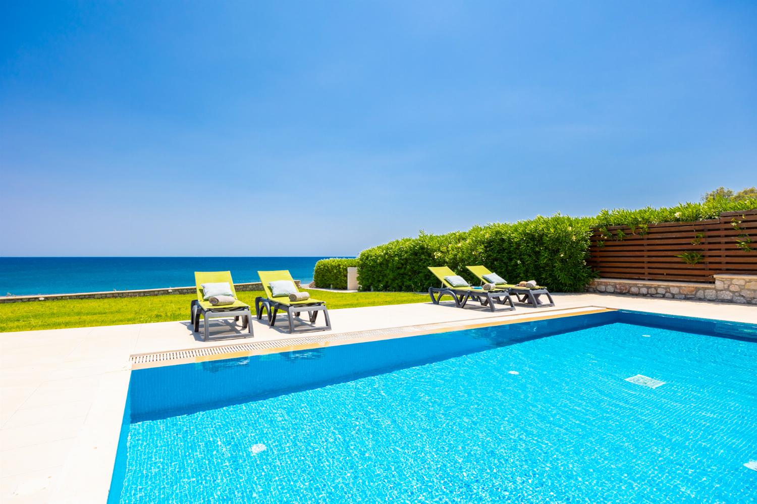 Private pool, terrace, and garden with sea views