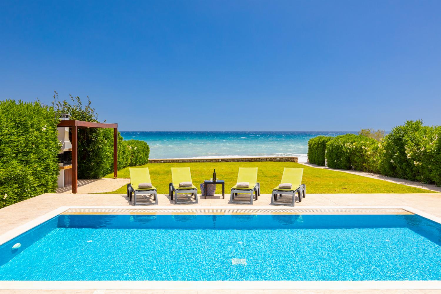 Private pool, terrace, and garden with panoramic sea views