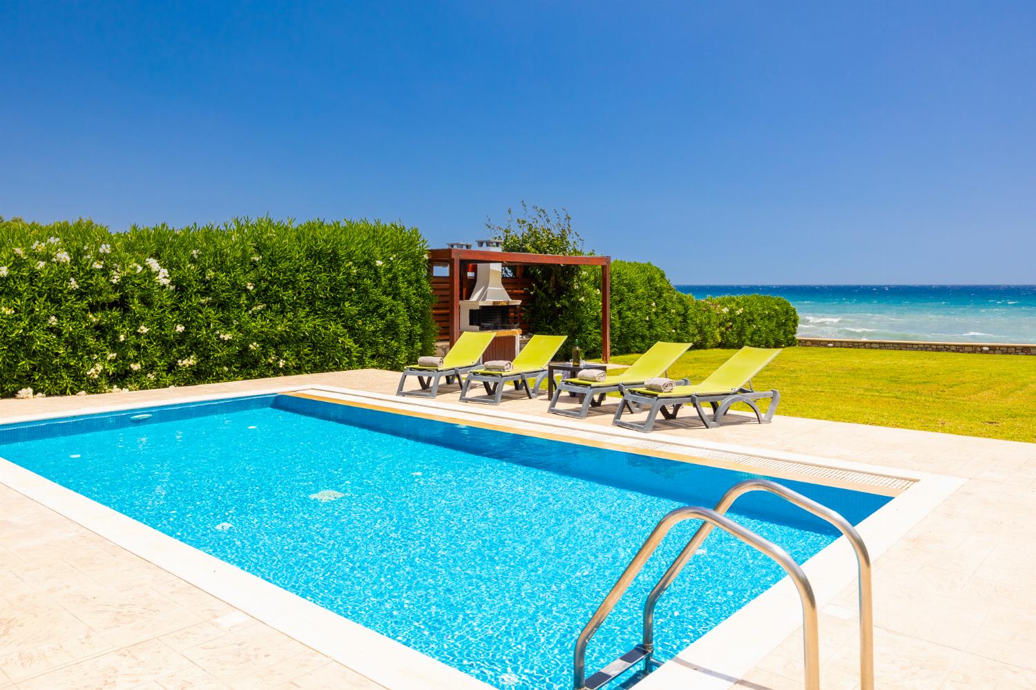 Private pool, terrace, and garden with panoramic sea views
