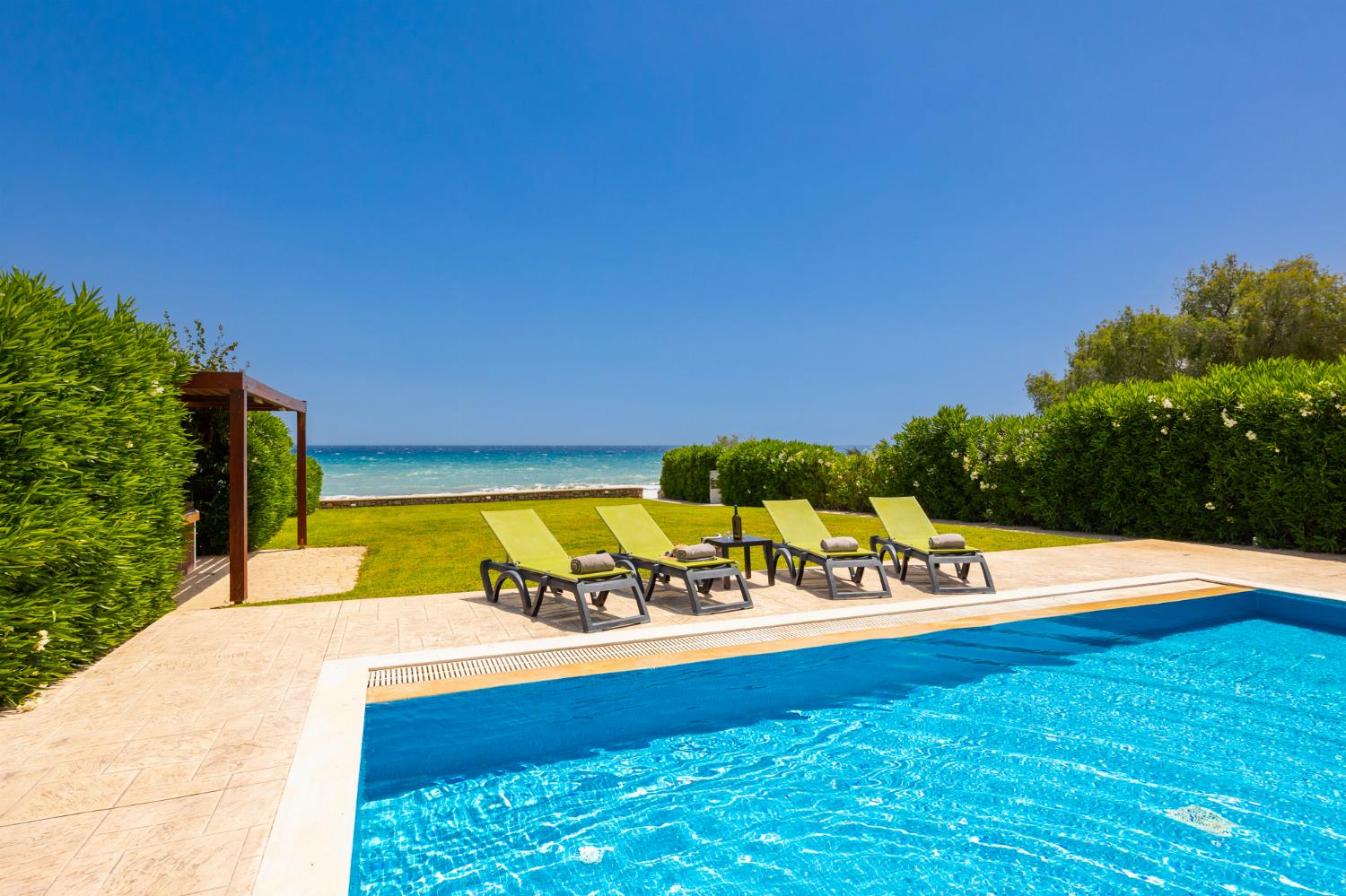 Private pool, terrace, and garden with panoramic sea views