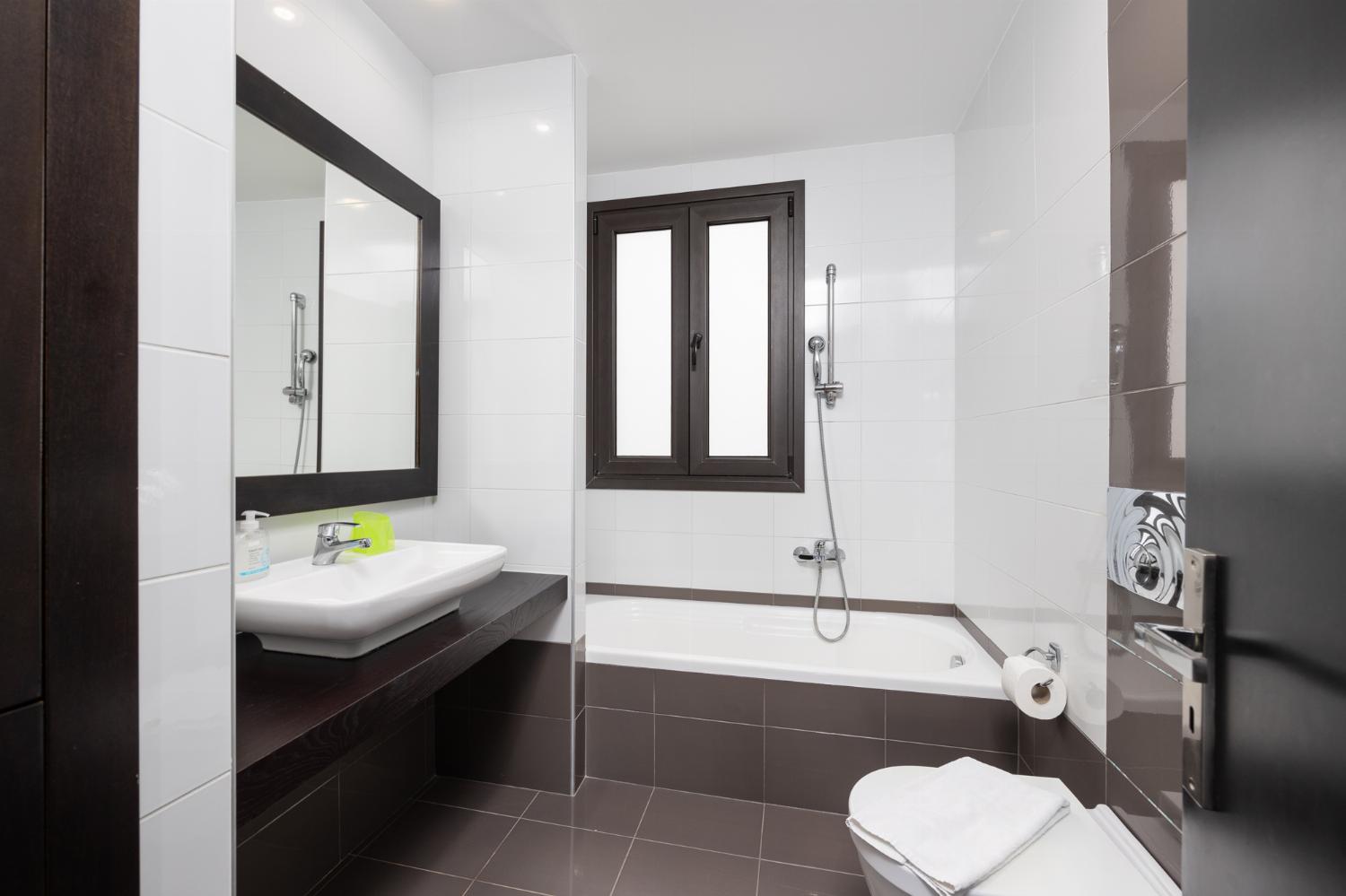 Family bathroom with bath and shower