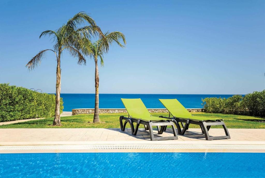 Beautiful villa with private pool, terrace, and lawn with panoramic sea views