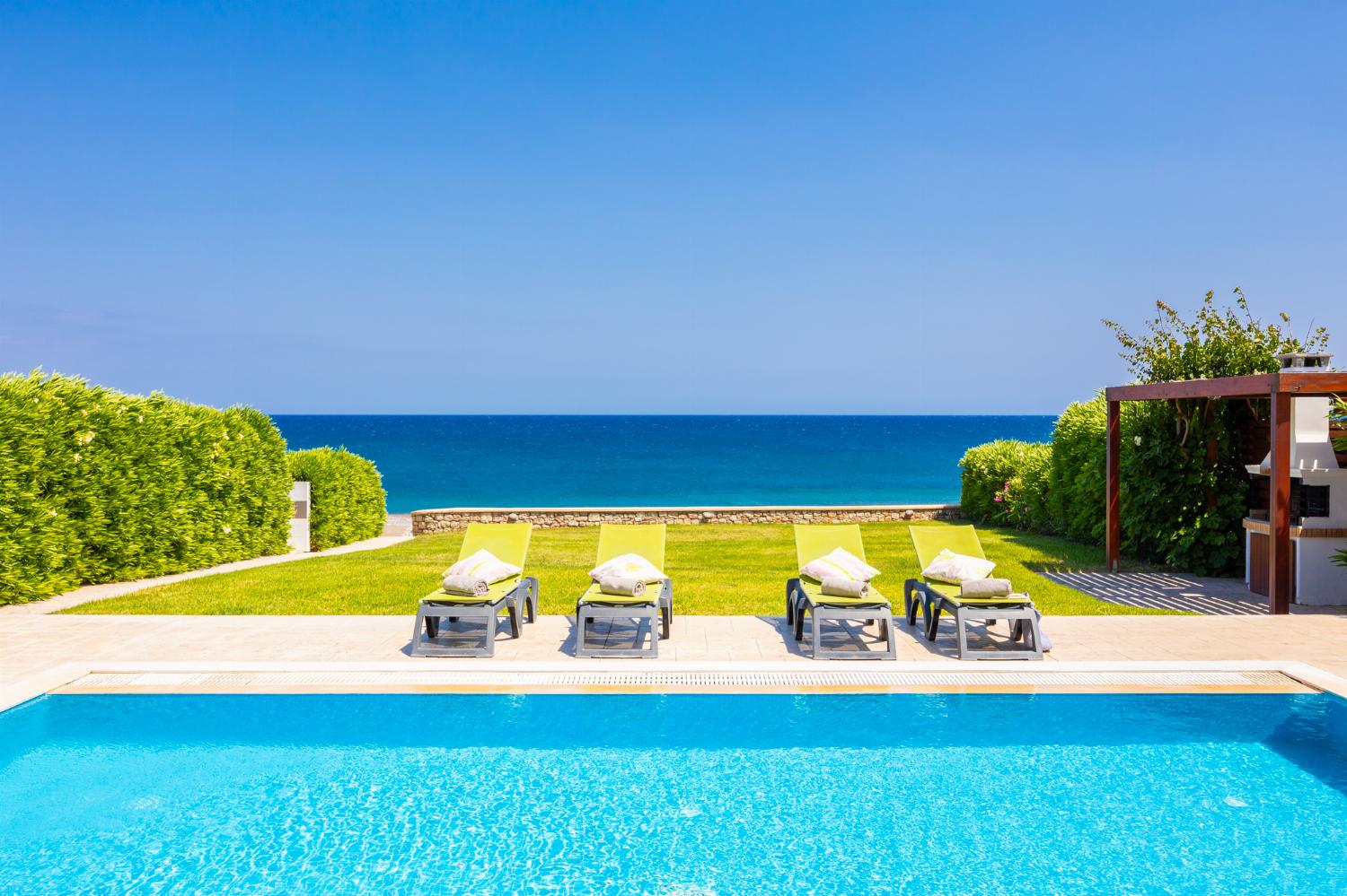 Private pool, terrace, and garden with panoramic sea views