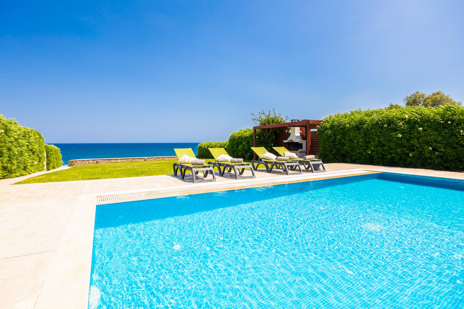 Private pool, terrace, and garden with panoramic sea views