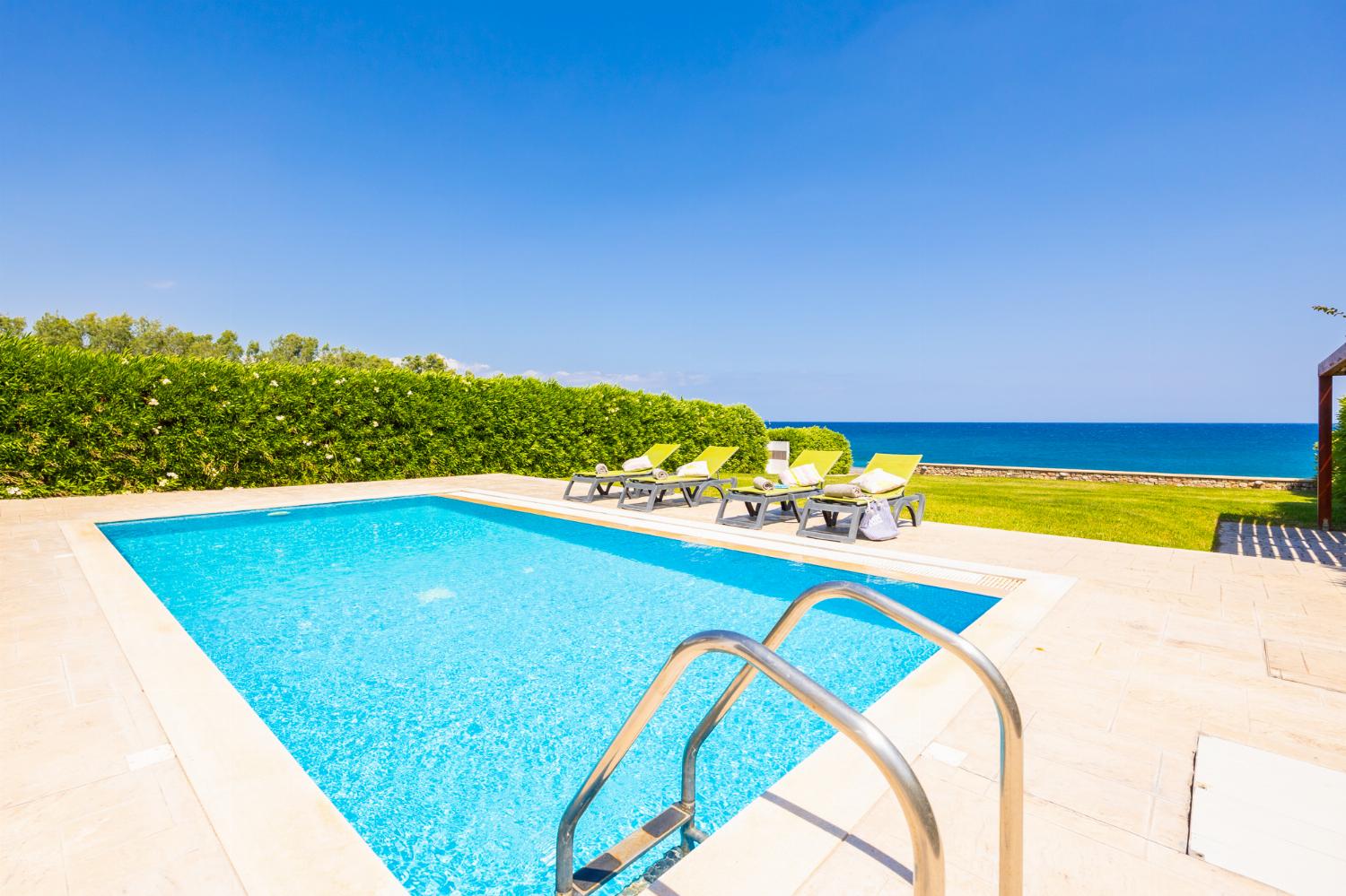 Private pool, terrace, and garden with panoramic sea views