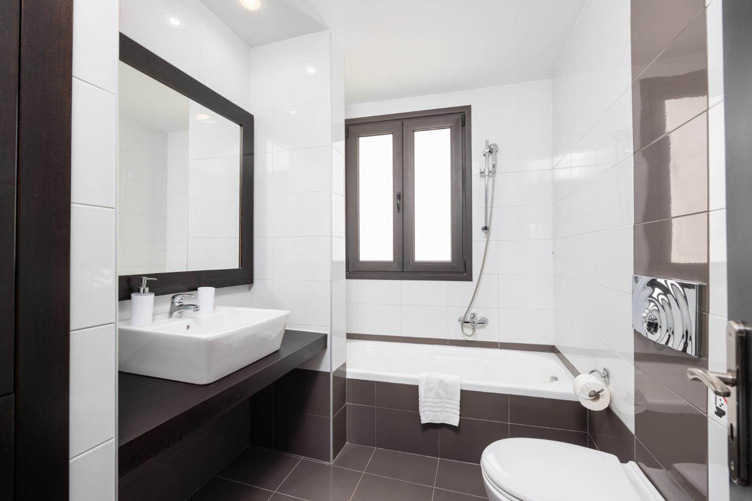 Family bathroom with bath and shower