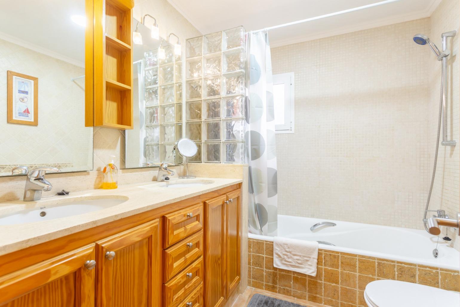 Family bathroom with bath and shower