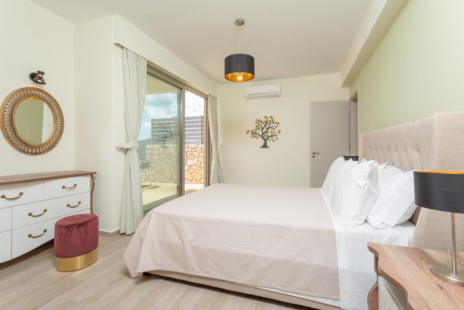 Double bedroom with en suite bathroom, A/C, and terrace access with sea views